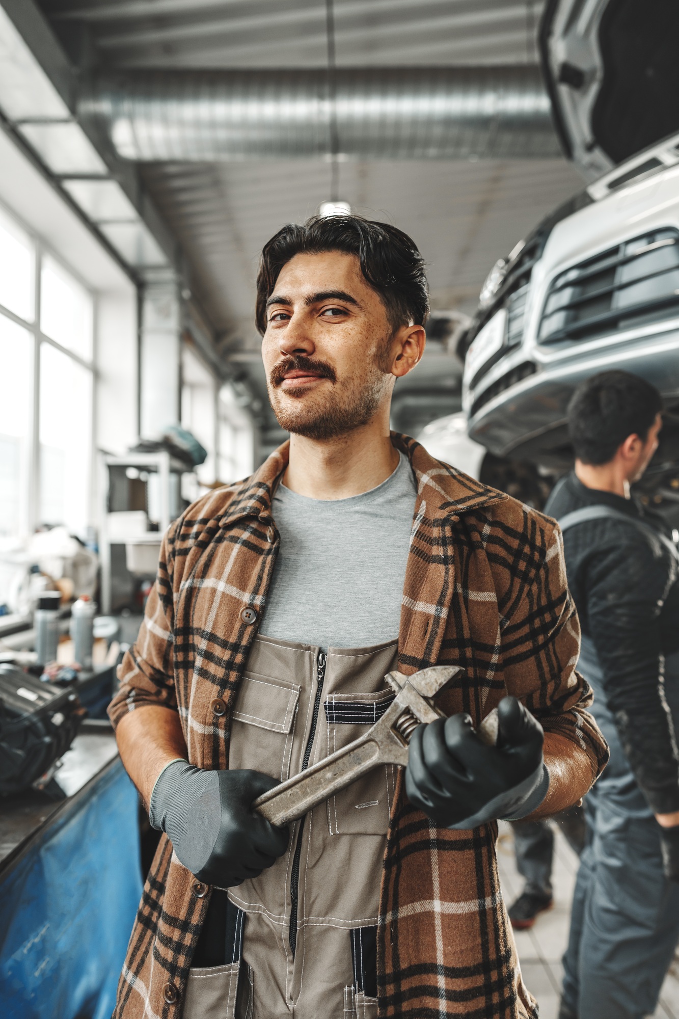 Portrait of a male mechanic in an auto repair shop